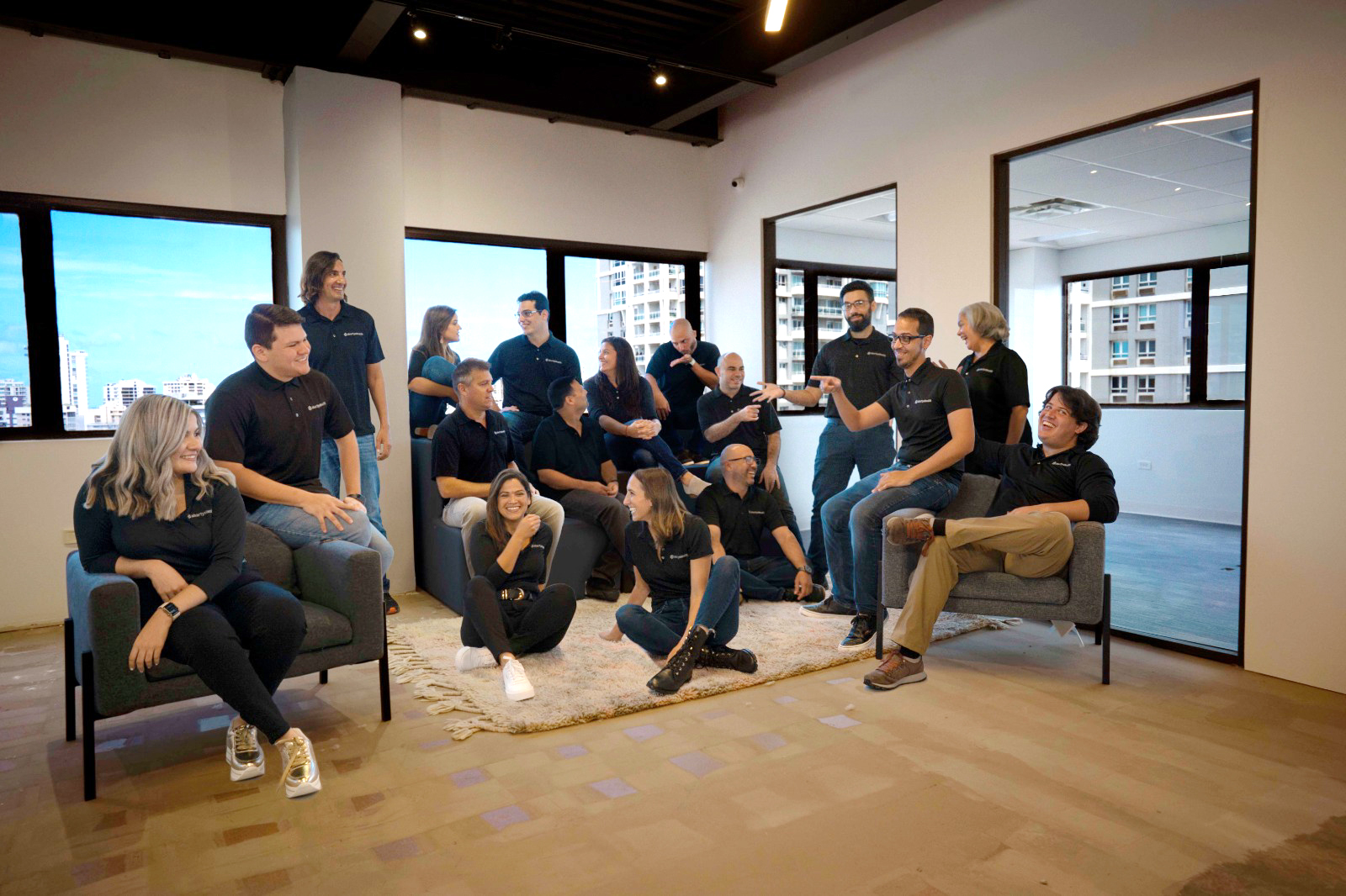 the abartyshealth team members hanging out in an office, talking and laughing